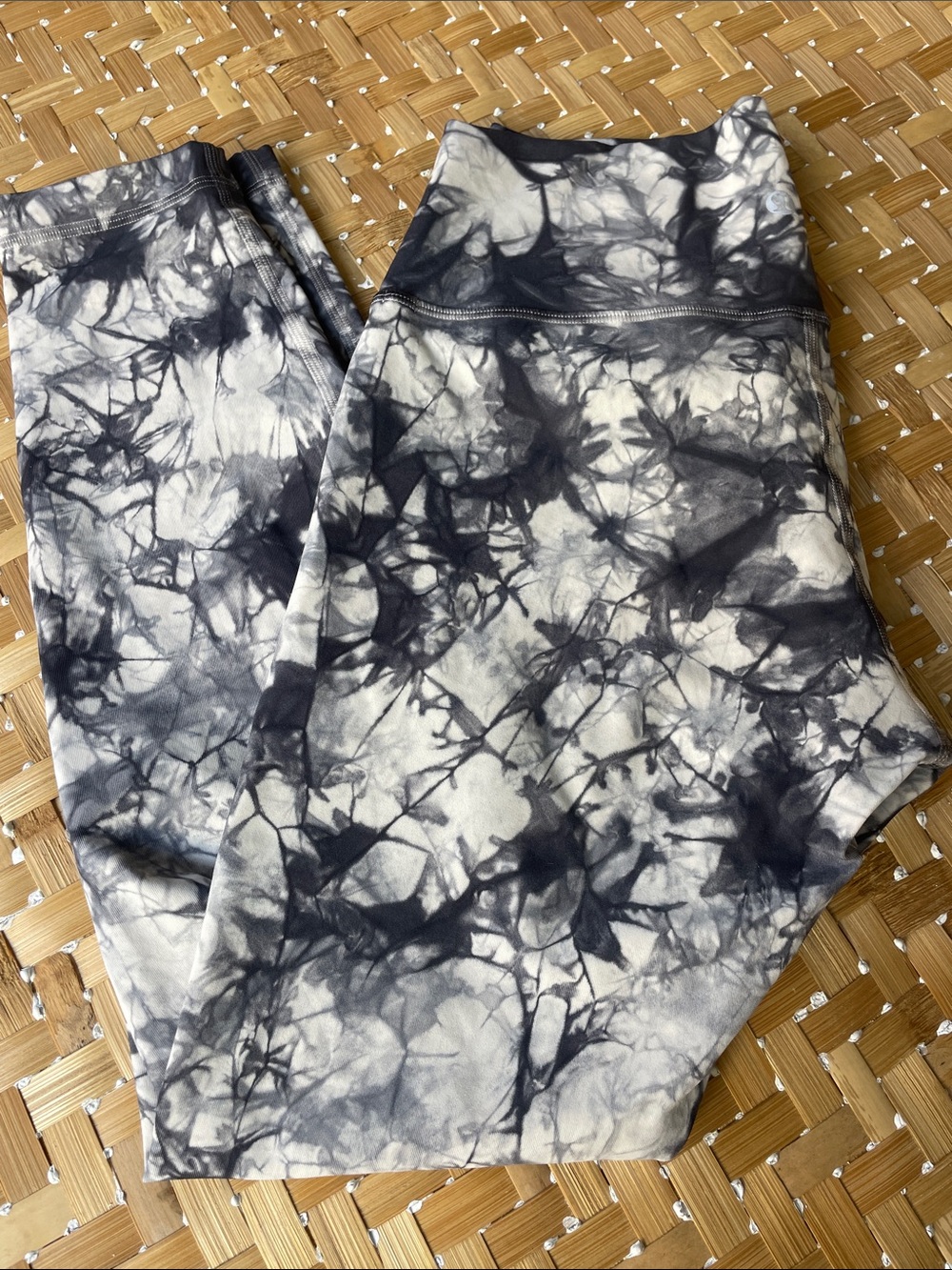 Lululemon Wunder Under high-rise leggings in a grey and white tie-dye pattern.